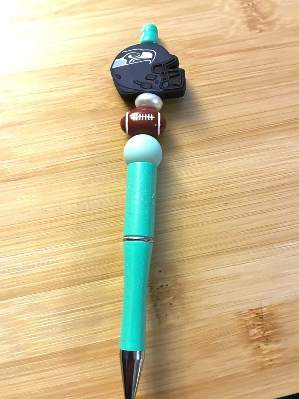 Teal Glitter Beaded Ballpoint Pen with Seahawks Football Bead